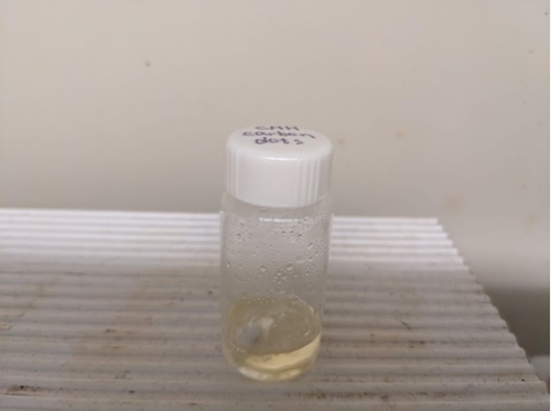 VIal with liquid slightly darker than before