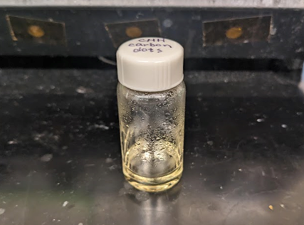 Vial of pale yellow-brown liquid