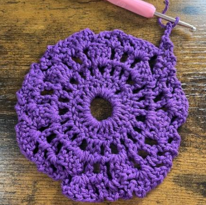 purple yarn crocheted into a spiral pattern